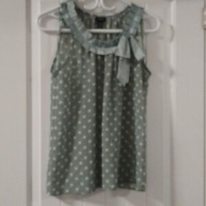 A2 rue 21 S sheer green/white polka dot top with pleat design around neckline.